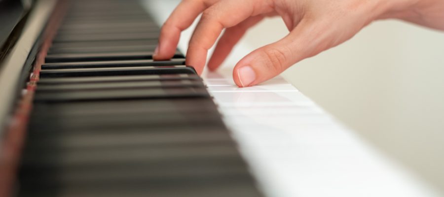 person with dystonia playing piano