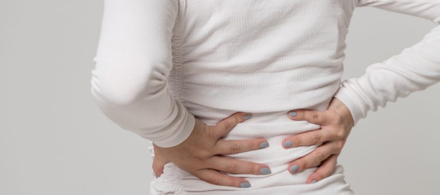 woman suffering back pain musculoskeletal disorder