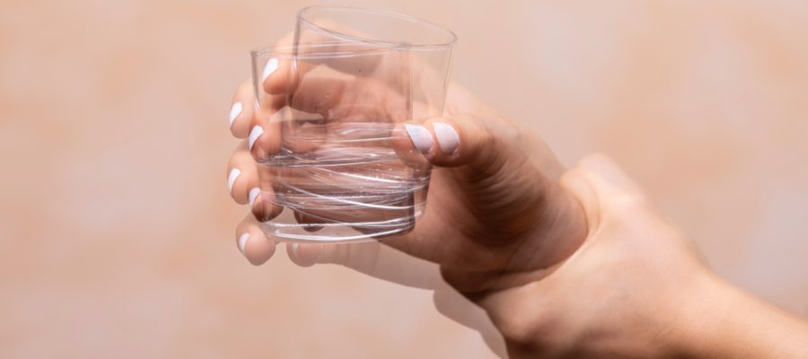 shaking hand of person with dystonia