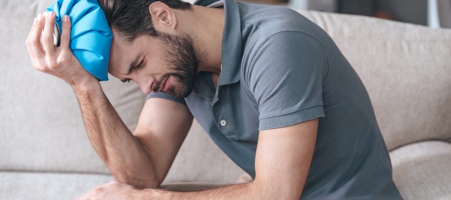 man with head injury with ice pack on head