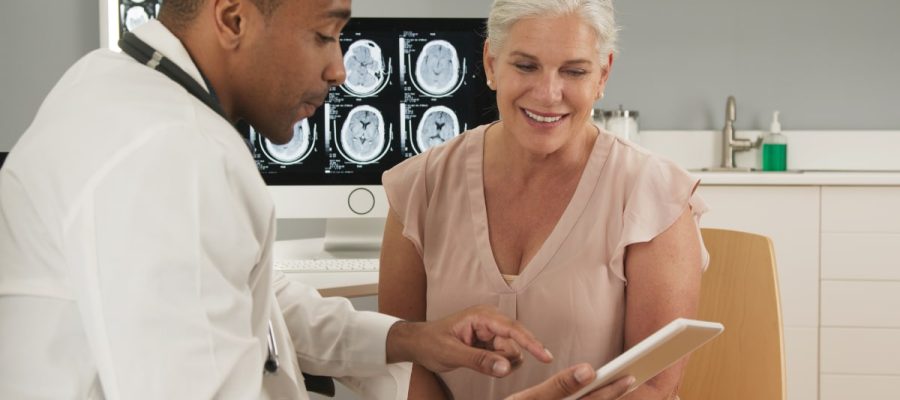 doctor reviews healthy food for concussion recovery with a patient.