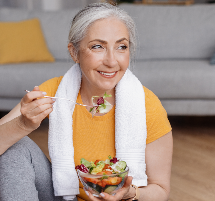 older woman eating salad