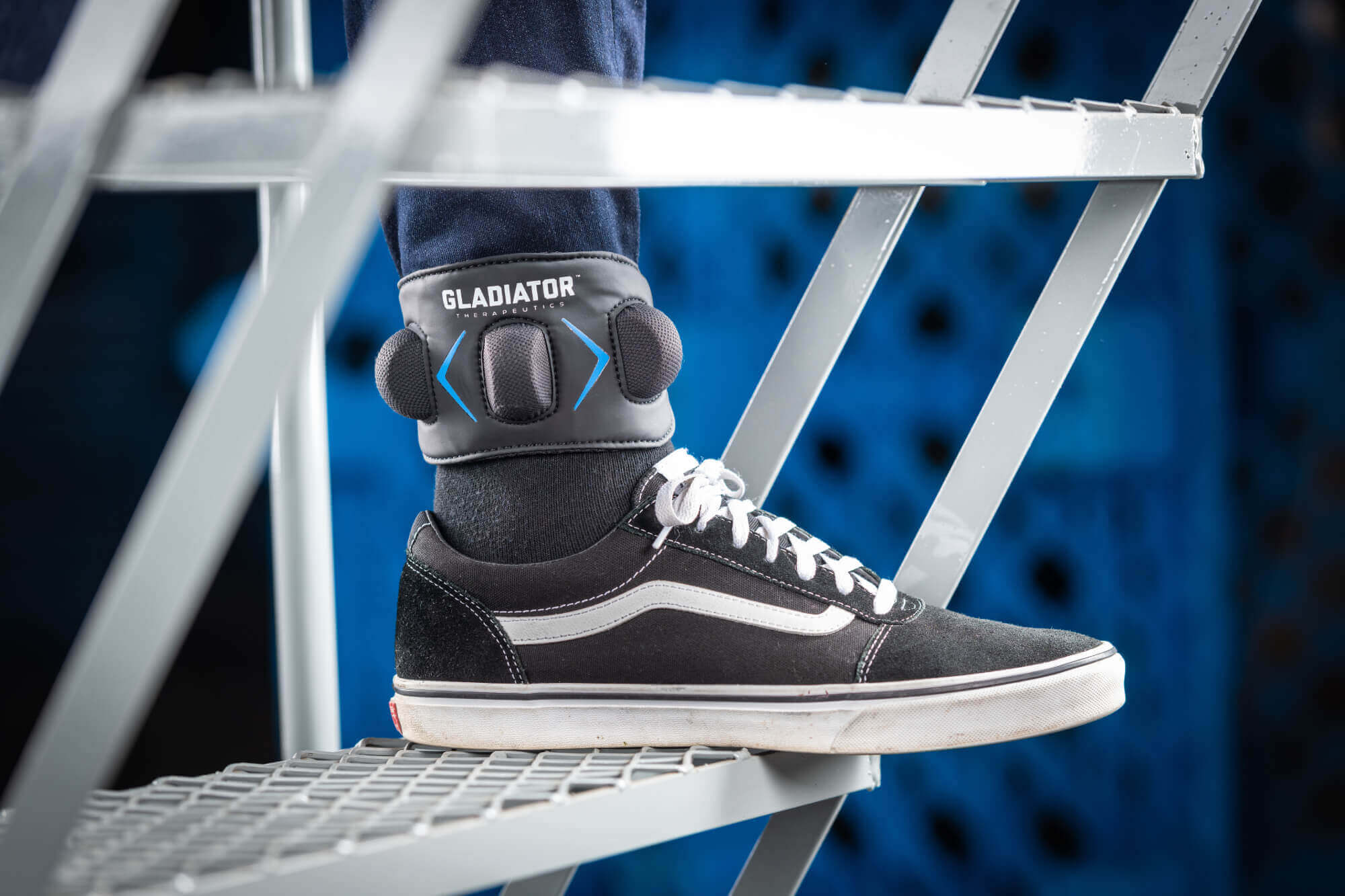 Gladiator Therapeutics Ankle Device person wearing a gladiator therapeutics ankle support.